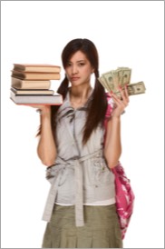 college student holding books in one hand cash in the other